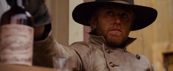 Movie still from “3:10 to Yuma” (2007), directed by James Mangold – A man wearing a hat and a leather jacket; Close Up shot, Low angle
