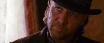 Movie still from “3:10 to Yuma” (2007), directed by James Mangold – A person wearing a hat; Close Up shot, Over the shoulder angle