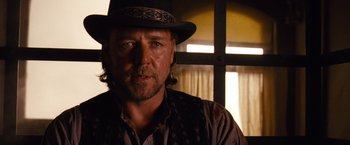 Movie still from “3:10 to Yuma” (2007), directed by James Mangold – A person wearing a hat; Close Up shot, Low angle