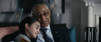 Movie still from “The Boys” (2019), created by Eric Kripke – An older man and a young girl sitting next to each other; Close Up shot, Over the shoulder angle