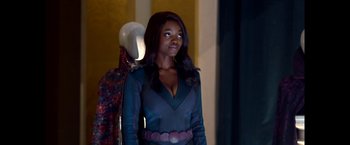 Movie still from “The Boys” (2019), created by Eric Kripke – A woman standing in front of a mirror; Medium shot, Over the shoulder angle