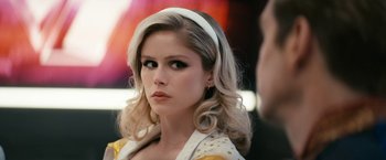 Movie still from “The Boys” (2019), created by Eric Kripke – A beautiful young woman with blonde hair wearing a headband; Close Up shot, Over the shoulder angle
