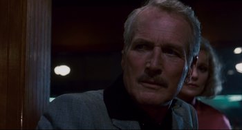 Movie still from “The Color of Money” (1986), directed by Martin Scorsese – An older man with a goatee looking at the camera; Close Up shot, Low angle