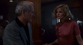 Movie still from “The Color of Money” (1986), directed by Martin Scorsese – A man and a woman talking to each other; Medium shot, Over the shoulder angle