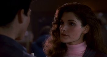 Movie still from “The Color of Money” (1986), directed by Martin Scorsese – A person wearing a pink shirt; Close Up shot, Over the shoulder angle