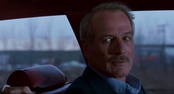 Movie still from “The Color of Money” (1986), directed by Martin Scorsese – A man sitting in the back of a car; Close Up shot, Low angle