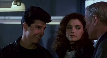 Movie still from “The Color of Money” (1986), directed by Martin Scorsese – A man and a woman standing next to each other; Close Up shot, Over the shoulder angle