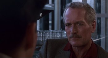 Movie still from “The Color of Money” (1986), directed by Martin Scorsese – A man sitting in front of another man; Close Up shot, Over the shoulder angle