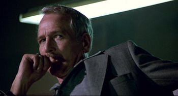 Movie still from “The Color of Money” (1986), directed by Martin Scorsese – An older man wearing a suit and tie; Close Up shot, Low angle