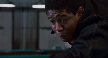 Movie still from “The Color of Money” (1986), directed by Martin Scorsese – A person sitting in a room; Close Up shot, Low angle