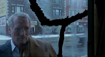 Movie still from “The Color of Money” (1986), directed by Martin Scorsese – A man looking out of a car window in the snow; Close Up shot, High angle
