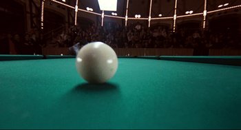 Movie still from “The Color of Money” (1986), directed by Martin Scorsese – A white ball is on a green pool table in front of a crowd; Extreme Close Up shot, Overhead angle