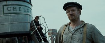 Movie still from “The Curious Case of Benjamin Button” (2008), directed by David Fincher – A man with a beard wearing a hat; Close Up shot, Low angle