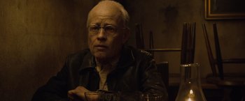 Movie still from “The Curious Case of Benjamin Button” (2008), directed by David Fincher – An older man with glasses and a leather jacket; Close Up shot, Low angle