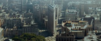 Movie still from “The Curious Case of Benjamin Button” (2008), directed by David Fincher – An aerial view of a large city with many tall buildings; Extreme Wide shot, Overhead angle