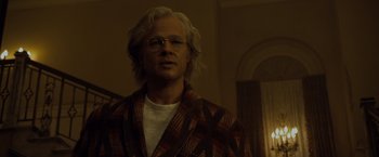 Movie still from “The Curious Case of Benjamin Button” (2008), directed by David Fincher – A man with long white hair wearing glasses and a robe; Close Up shot, Low angle