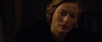Movie still from “The Curious Case of Benjamin Button” (2008), directed by David Fincher – A woman's face in the dark; Close Up shot, Over the shoulder angle