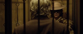Movie still from “The Curious Case of Benjamin Button” (2008), directed by David Fincher – A person with a hat is looking in the mirror; Close Up shot, Over the shoulder angle