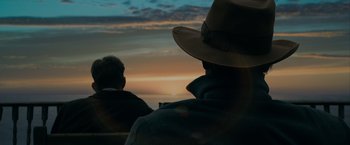Movie still from “The Curious Case of Benjamin Button” (2008), directed by David Fincher – Two men sitting in front of a sunset; Close Up shot, Over the shoulder angle