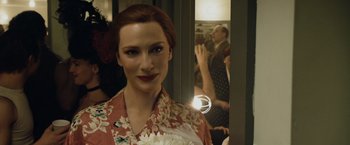 Movie still from “The Curious Case of Benjamin Button” (2008), directed by David Fincher – A woman standing in front of a mirror; Close Up shot, Over the shoulder angle