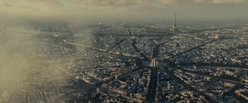 Movie still from “The Curious Case of Benjamin Button” (2008), directed by David Fincher – An aerial view of a large city with many buildings; Extreme Wide shot, High angle