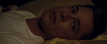 Movie still from “The Curious Case of Benjamin Button” (2008), directed by David Fincher – A person laying in a bed; Close Up shot, Overhead angle