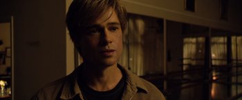 Movie still from “The Curious Case of Benjamin Button” (2008), directed by David Fincher – A person wearing a jacket; Close Up shot, Over the shoulder angle