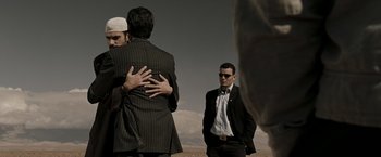 Movie still from “Body of Lies” (2008), directed by Ridley Scott – Medium shot, Over the shoulder angle