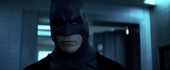 Movie still from “The Dark Knight” (2008), directed by Christopher Nolan – A person wearing a batman mask; Close Up shot, Low angle