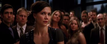 Movie still from “The Dark Knight” (2008), directed by Christopher Nolan – A group of people standing in a room; Close Up shot, Over the shoulder angle