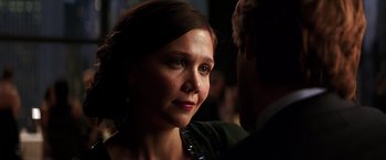 Movie still from “The Dark Knight” (2008), directed by Christopher Nolan – A person wearing a jacket; Close Up shot, Over the shoulder angle