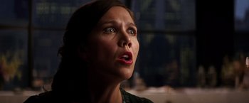 Movie still from “The Dark Knight” (2008), directed by Christopher Nolan – A person looking up at the sky; Close Up shot, Low angle