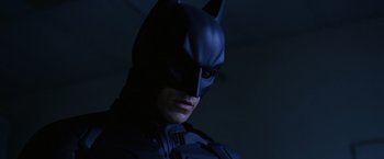 Movie still from “The Dark Knight” (2008), directed by Christopher Nolan – A person wearing a batman costume; Close Up shot, Low angle