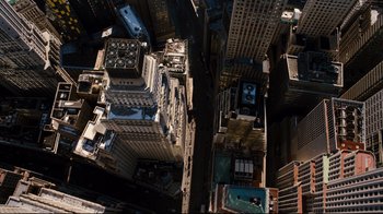 Movie still from “The Dark Knight Rises” (2012), directed by Christopher Nolan – An aerial view of a large city with many buildings; Extreme Wide shot, Overhead angle