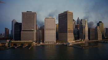 Movie still from “The Dark Knight Rises” (2012), directed by Christopher Nolan – A view of a large city from across the water; Extreme Wide shot, High angle