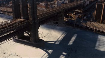 Movie still from “The Dark Knight Rises” (2012), directed by Christopher Nolan – A view of a bridge from a helicopter; Extreme Wide shot, Overhead angle