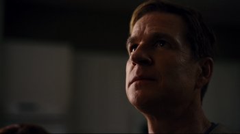 Movie still from “The Dark Knight Rises” (2012), directed by Christopher Nolan – A person looking up at the sky; Close Up shot, Low angle