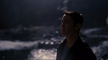 Movie still from “The Dark Knight Rises” (2012), directed by Christopher Nolan – A man standing in the middle of the night; Close Up shot, High angle