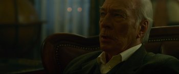 Movie still from “The Girl with the Dragon Tattoo” (2011), directed by David Fincher – An older man sitting in a chair looking off to his right; Close Up shot, Low angle