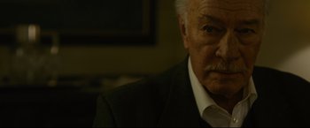 Movie still from “The Girl with the Dragon Tattoo” (2011), directed by David Fincher – An older man in a black suit and white tie; Close Up shot, Over the shoulder angle