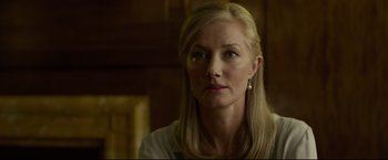 Movie still from “The Girl with the Dragon Tattoo” (2011), directed by David Fincher – A person with long blonde hair; Close Up shot, Low angle