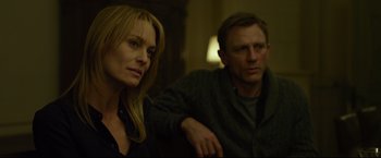 Movie still from “The Girl with the Dragon Tattoo” (2011), directed by David Fincher – A man and a woman sitting next to each other in a room; Close Up shot, Over the shoulder angle