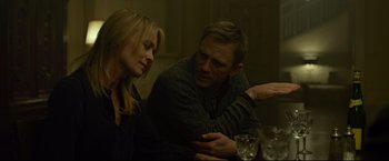 Movie still from “The Girl with the Dragon Tattoo” (2011), directed by David Fincher – A man and a woman sitting at a dinner table; Close Up shot, Over the shoulder angle