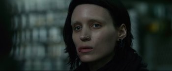 Movie still from “The Girl with the Dragon Tattoo” (2011), directed by David Fincher – A person with a nose ring; Close Up shot, Low angle