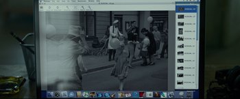 Movie still from “The Girl with the Dragon Tattoo” (2011), directed by David Fincher – An old photo of people walking down the street; Wide shot, High angle