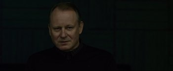 Movie still from “The Girl with the Dragon Tattoo” (2011), directed by David Fincher – A person wearing a black shirt; Close Up shot, Low angle