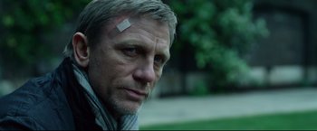 Movie still from “The Girl with the Dragon Tattoo” (2011), directed by David Fincher – A person with a bandage on his head; Close Up shot, Low angle