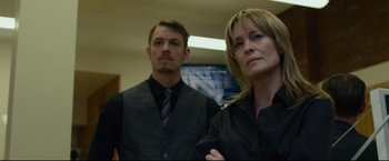 Movie still from “The Girl with the Dragon Tattoo” (2011), directed by David Fincher – A man and a woman standing next to each other; Medium shot, Low angle