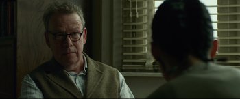 Movie still from “The Girl with the Dragon Tattoo” (2011), directed by David Fincher – An older man wearing glasses talking to a younger man; Close Up shot, Over the shoulder angle