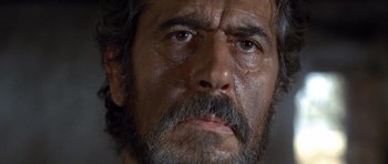 Movie still from “The Good, the Bad and the Ugly” (1966), directed by Sergio Leone – A person with a beard; Close Up shot, Low angle